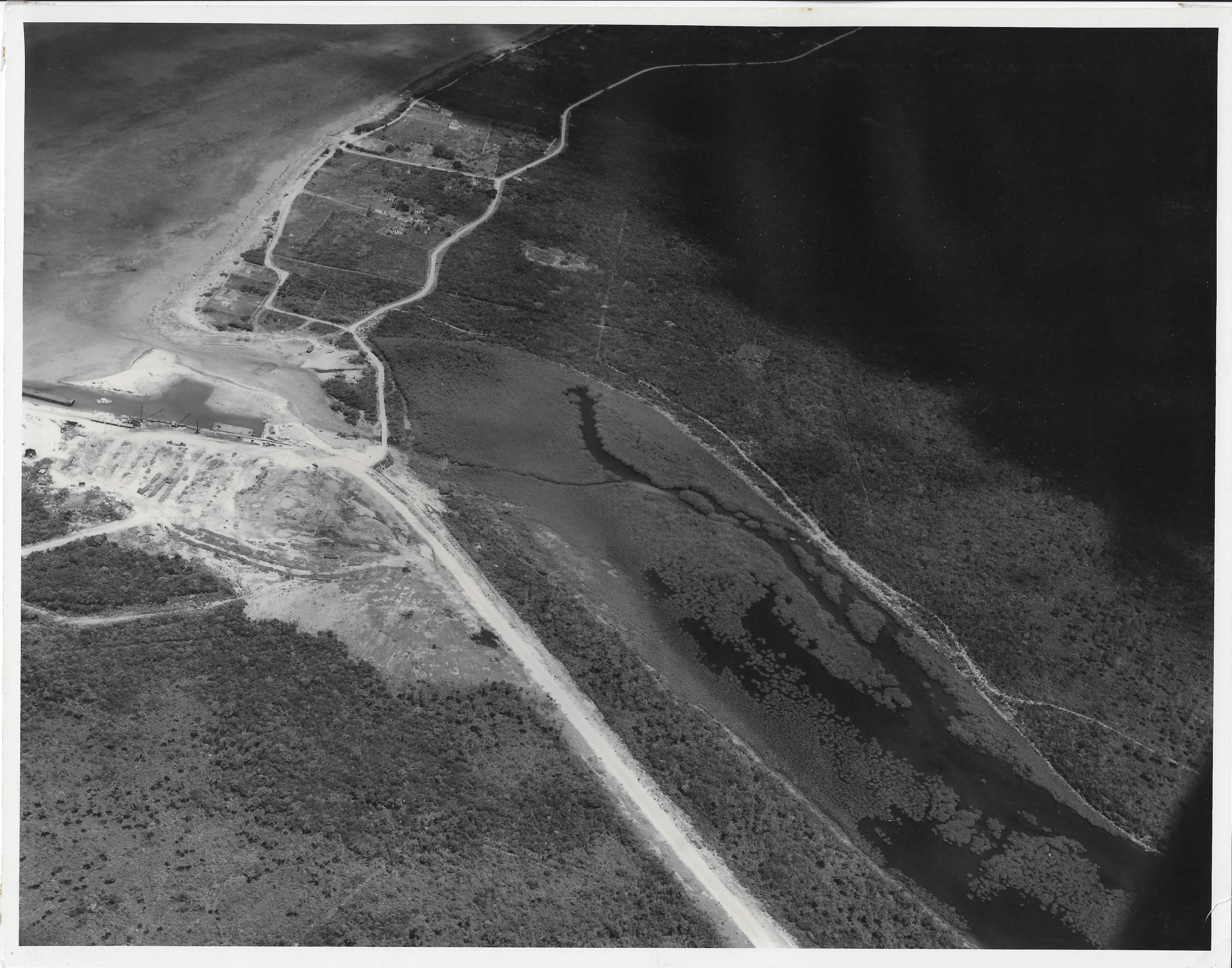Aerial view of Hawksbill Creek and settlement of Eight Mile Rock, July 15, 1955